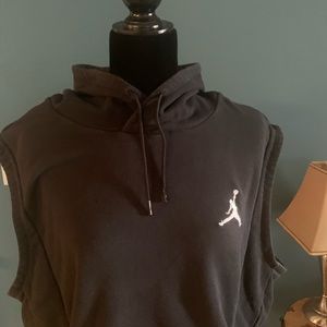 Black sleeveless Jordan hoodie.